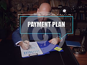 PAYMENT PLAN text in footnote block. Modern Banker checking financial report AÂ termÂ payment planÂ involves receiving equal